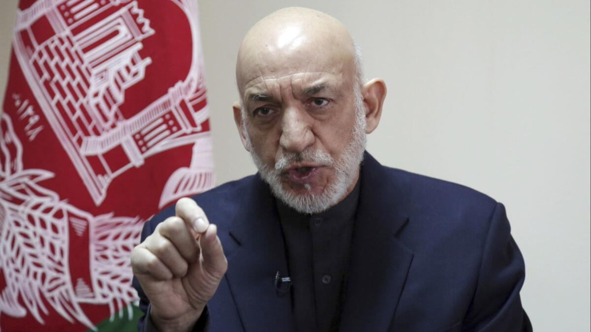 Former Afghan President Hamid Karzai speaks during an interview in Kabul, Afghanistan, on Feb. 16.