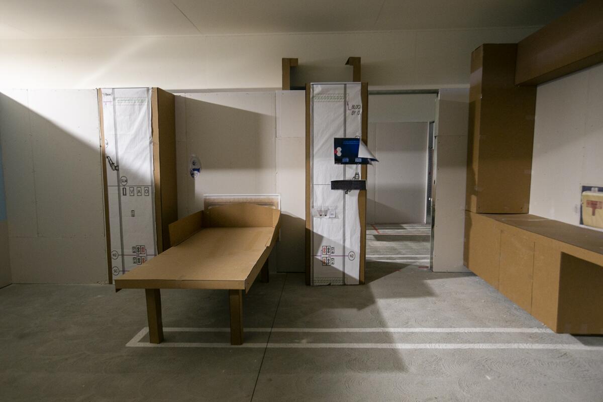 A full-scale replica of a patient room made from cardboard and temporary walls, at City of Hope Orange County in Irvine.