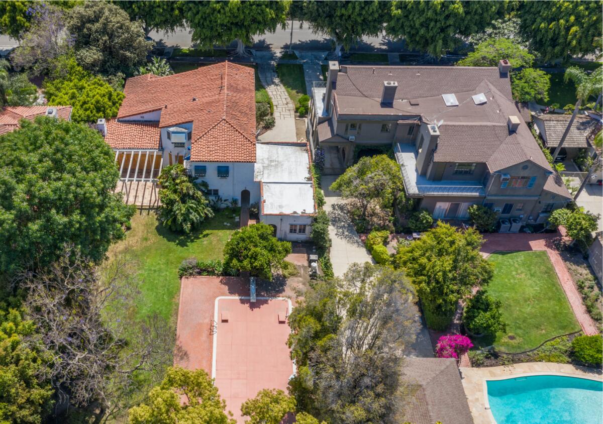 Aerial view of the two side-by-side estates: a 1930s Traditional-style home, right, and 1920s Spanish-style home.