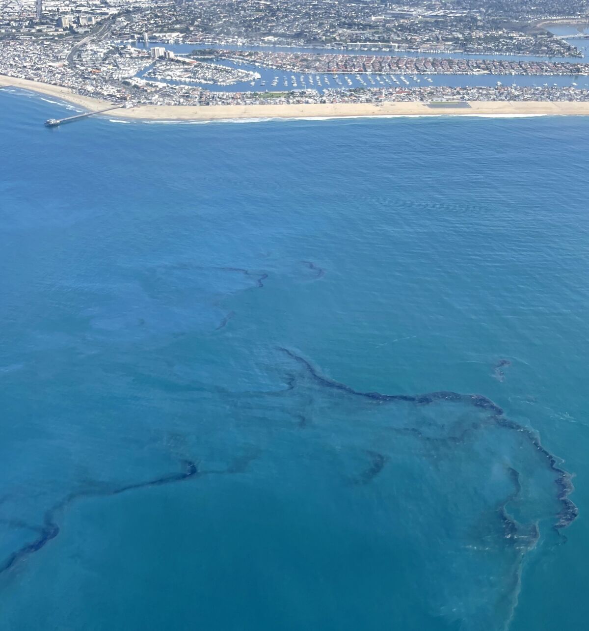 Crude oil is shown in the Pacific Ocean off the coast of Newport Beach on Oct. 3.