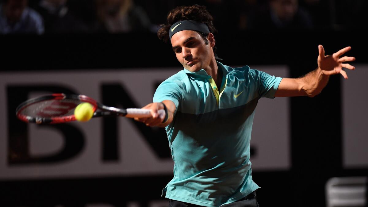 Roger Federer hits a return during his semifinal victory over Stan Wawrinka at the Italian Open on Saturday.
