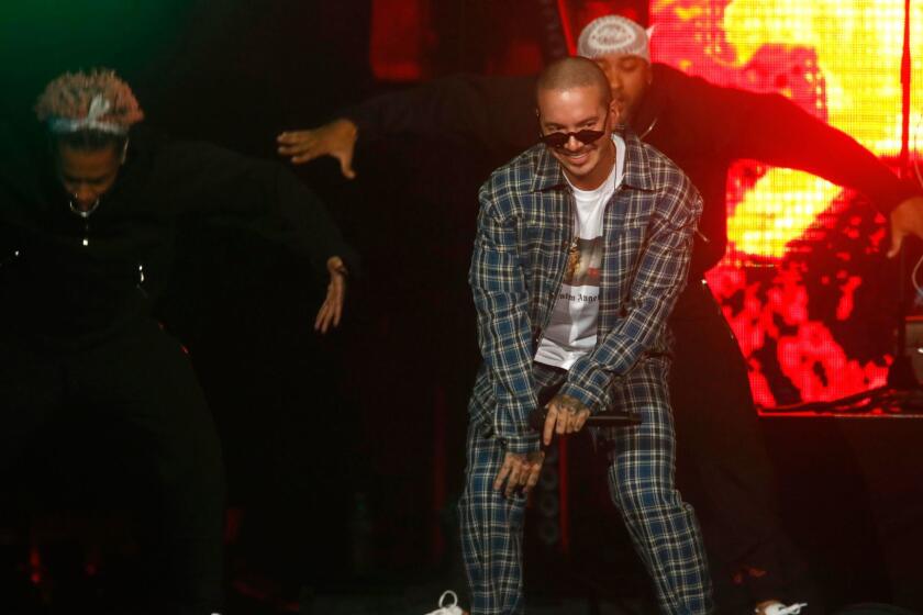 LOS ANGELES, CA - JANUARY 20, 2018 -- J Balvin, in plaid outfit, performs during the CALIBASH concert at Staples Center in Los Angeles on January 20, 2018.(Genaro Molina / Los Angeles Times)