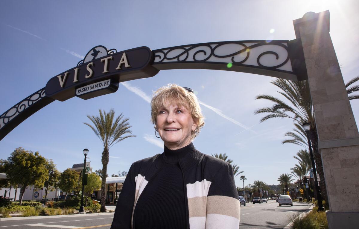  Portrait of former Vista Mayor Judy Ritter under one of the welcoming archways to downtown Vista on S. Santa Fe Avenue.
