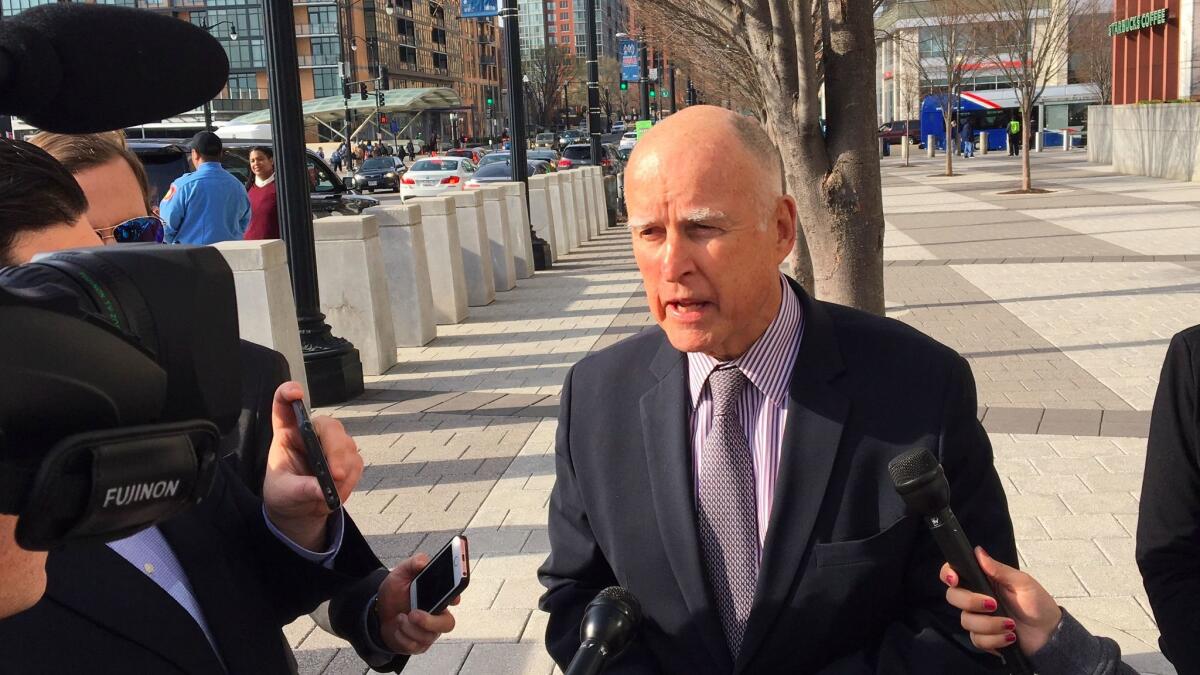 Gov. Jerry Brown speaks to reporters in Washington, D.C., Tuesday after a meeting with Transportation Secretary Elaine Chao.