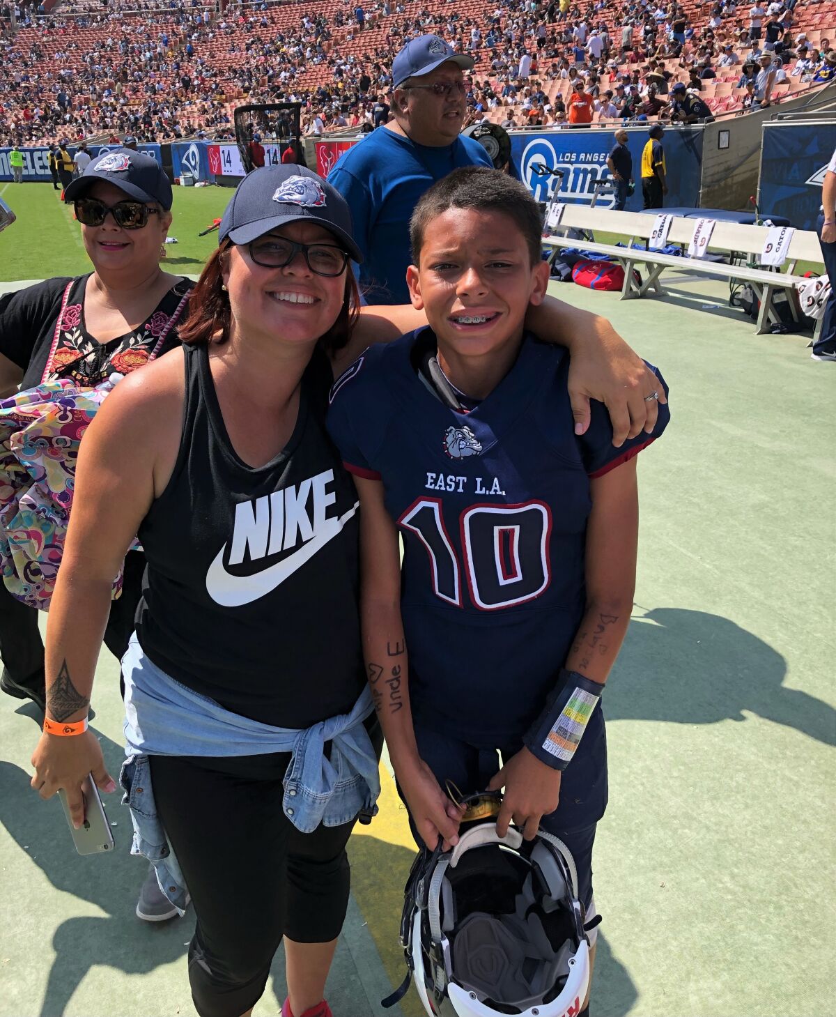 Jayden Barnes with his mother Leslie at the Coliseum before the East L.A. Classic.