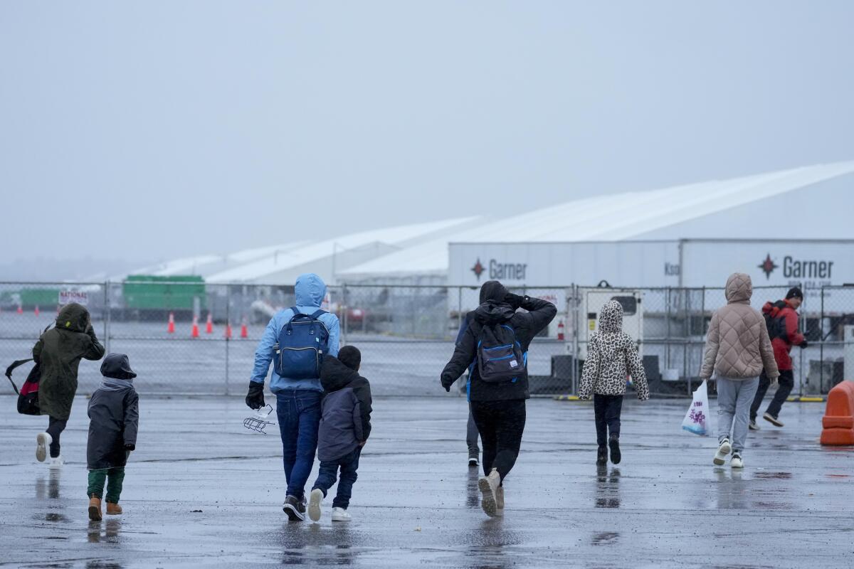 Storm Forces Evacuation of NYC Migrant Camp, Ignites Controversy Amid National Debate