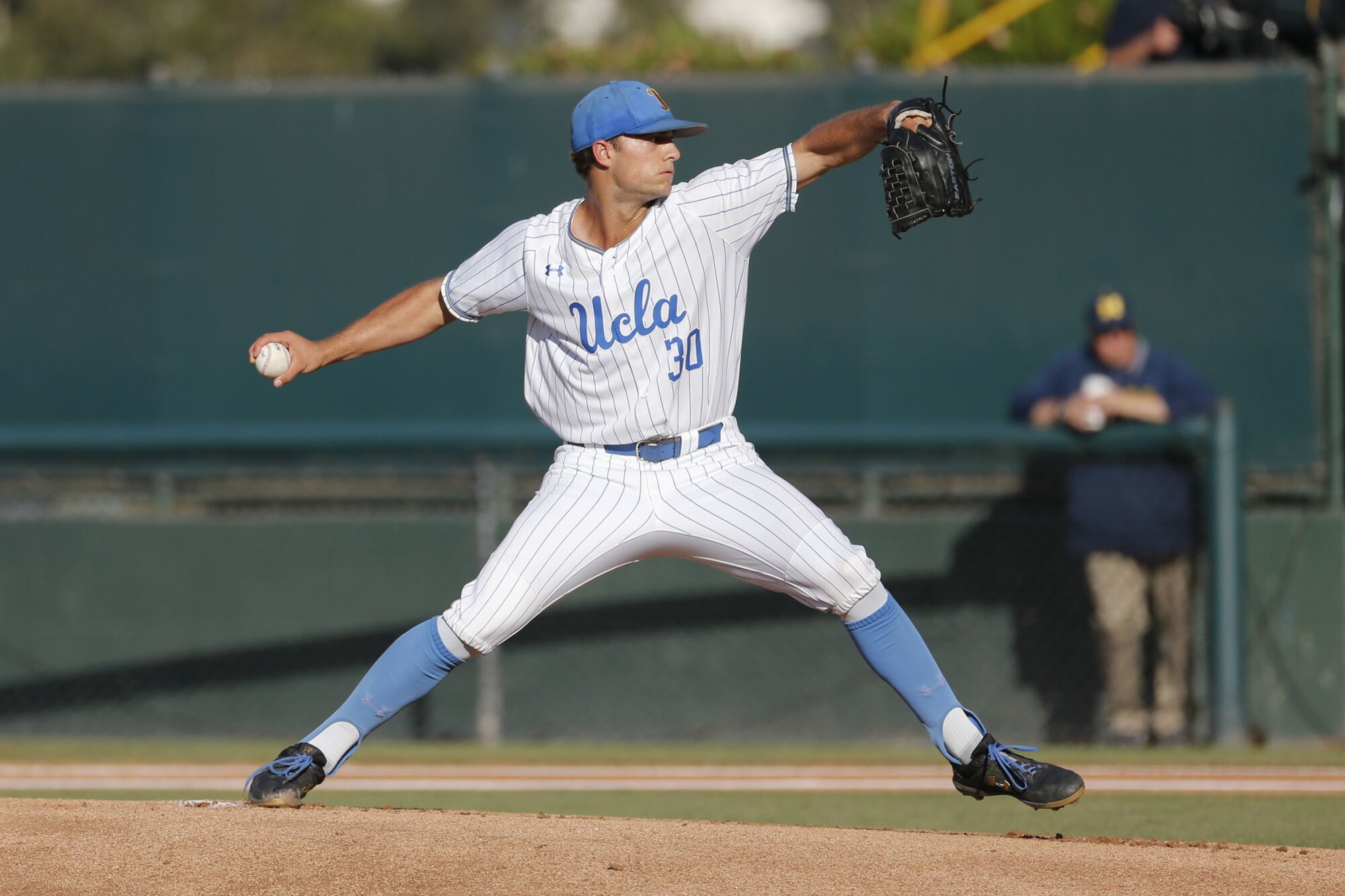 Nick Nastrini pitches for UCLA against Michigan in 2019.