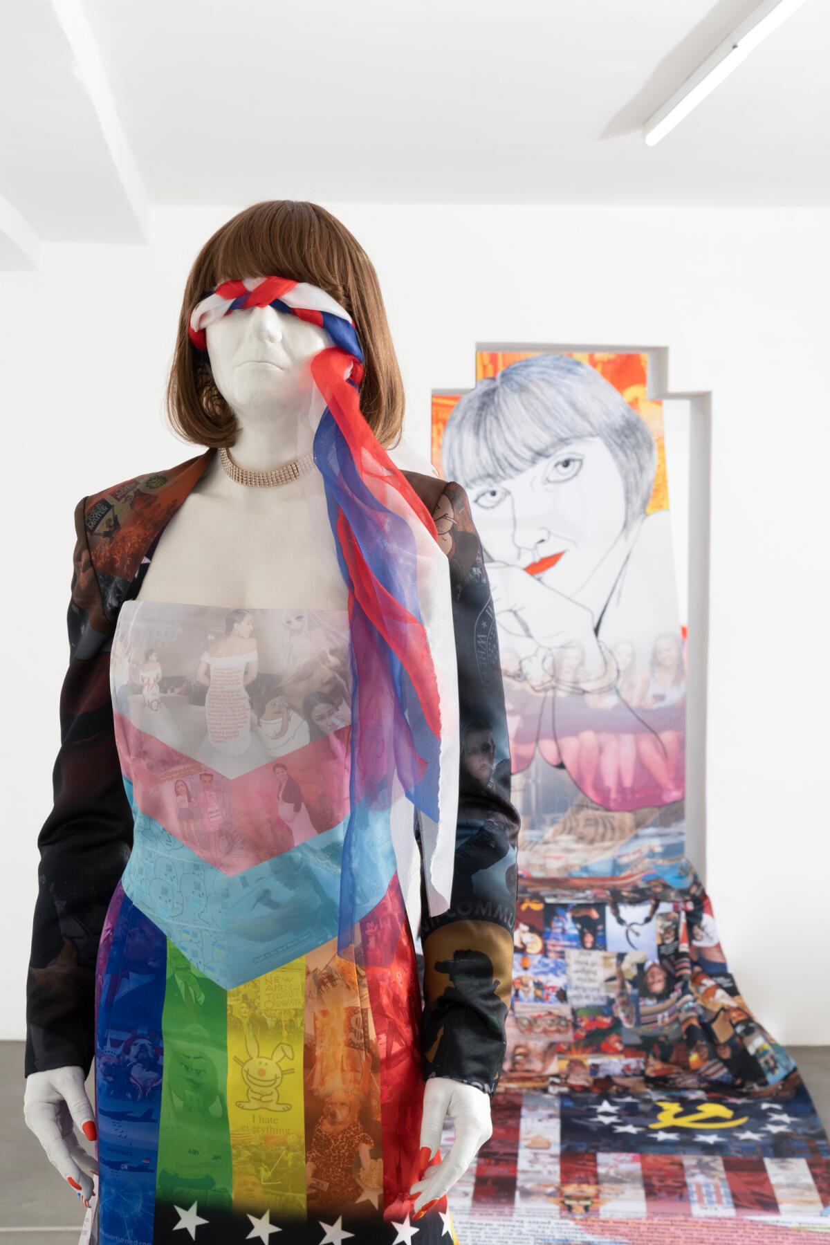 mannequin covered in clothing representing the LGBTQ and trans flags 