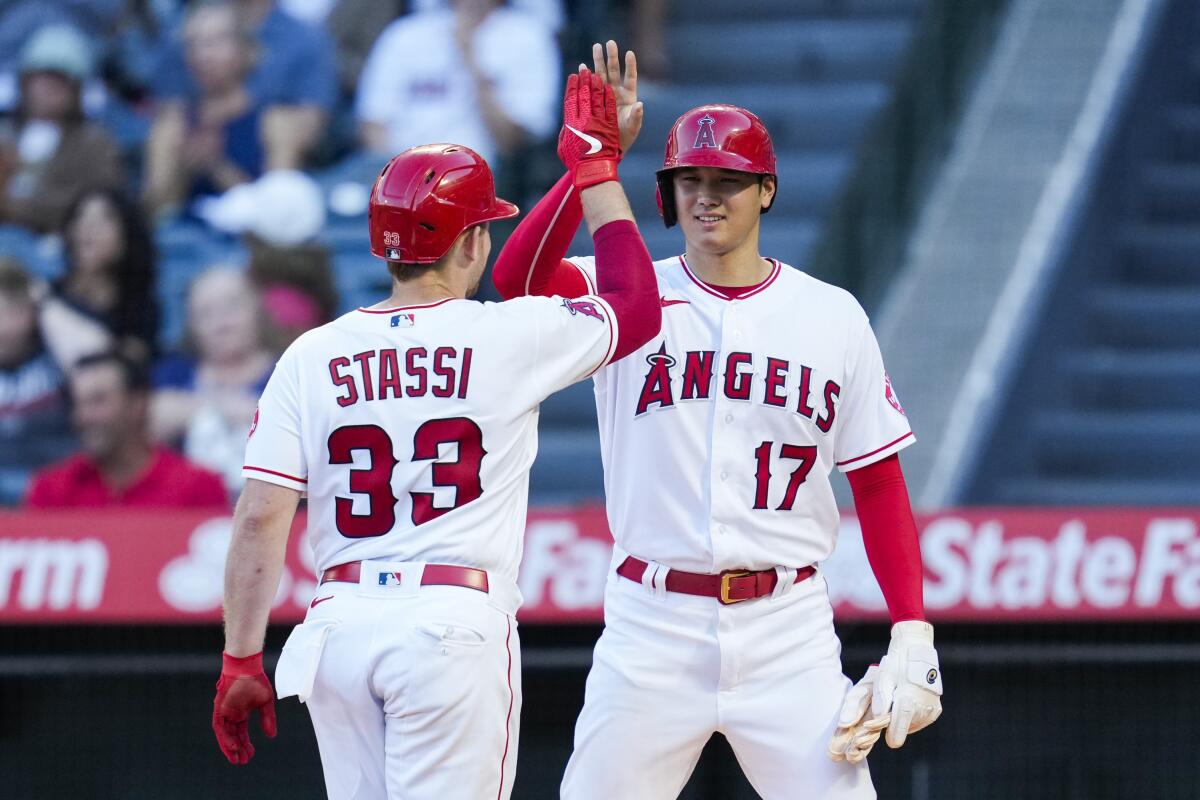 Shohei Ohtani pitched seven innings and had a double in the Angels win over the Red Sox. (AP Photo/Ashley Landis)