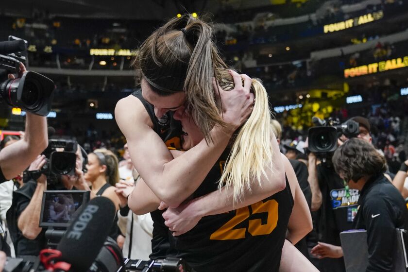 Iowa's Caitlin Clark and Monika Czinano celebrate after an NCAA Women's Final Four semifinals basketball game against South CarolinaFriday, March 31, 2023, in Dallas. Iowa won 77-73 to advance to the championship on Sunday. (AP Photo/Tony Gutierrez)
