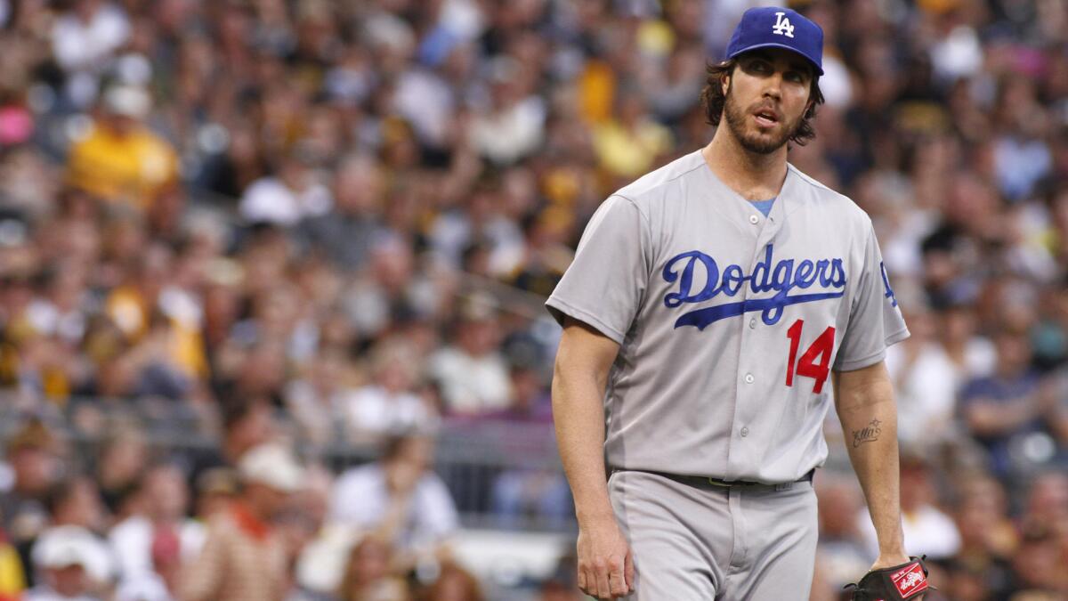 Dodgers starter Dan Haren reacts after giving up a fourth run in the first inning of the team's 6-1 loss to the Pittsburgh Pirates on Wednesday.