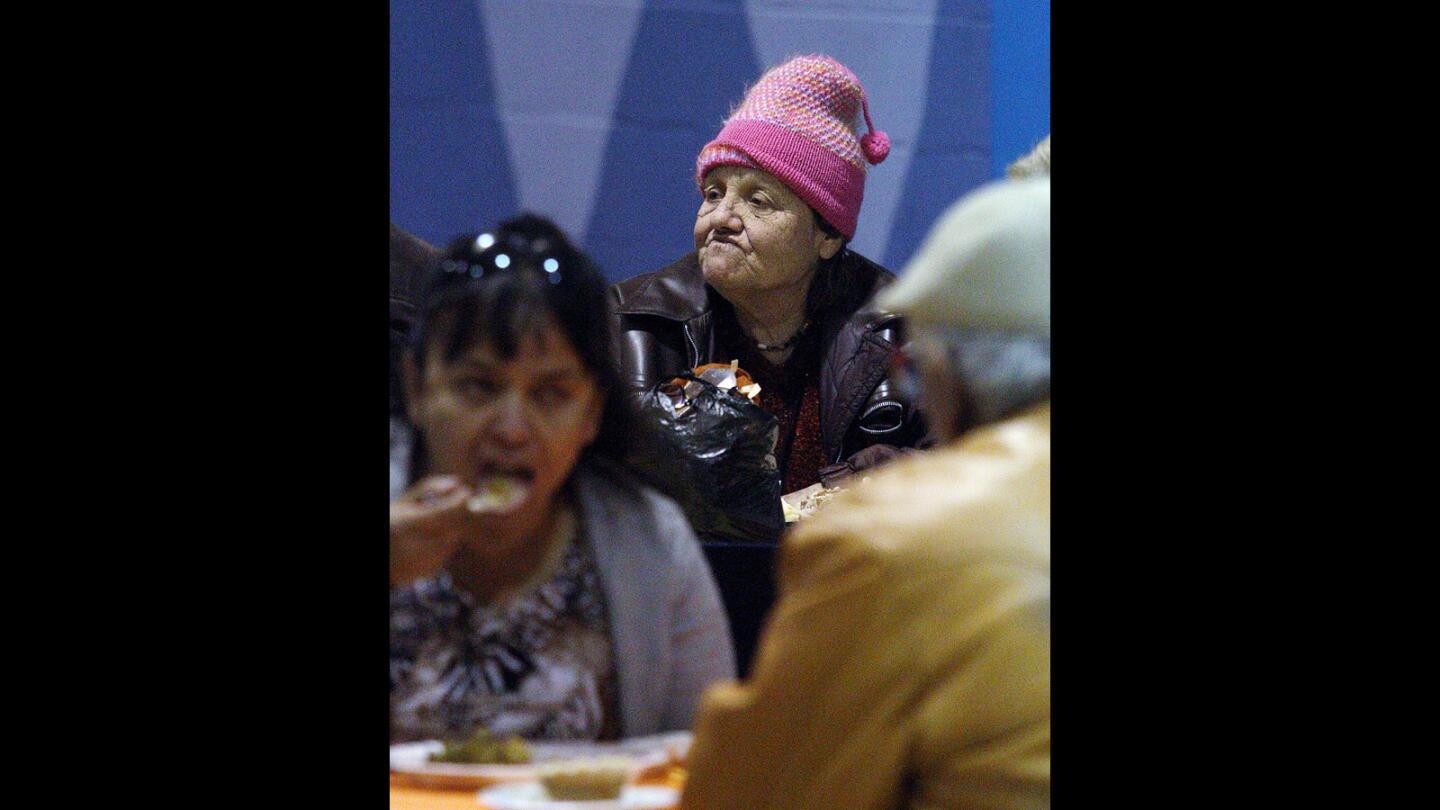 Elaine Popkin eats a Thanksgiving meal at the Salvation Army Glendale Corps and Community Center Thanksgiving dinner in Glendale on Thursday, Nov. 26, 2015.