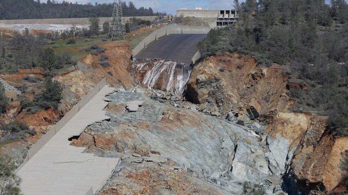 A small flow of water goes down Oroville Dam's crippled spillway in February.