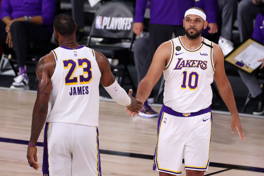 LAKE BUENA VISTA, FLORIDA - SEPTEMBER 12: LeBron James #23 of the Los Angeles Lakers high fives Jared Dudley.