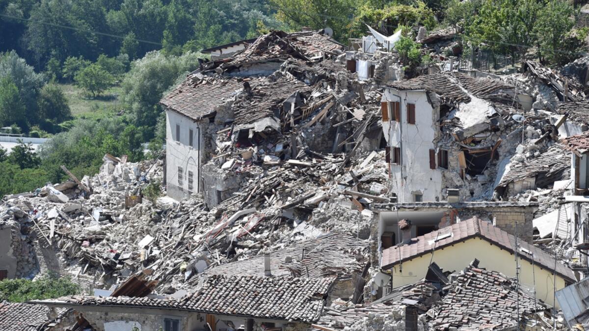 Buildings in Pescara del Tronto were reduced to a pile of rubble by the earthquake as the search for survivors continues.