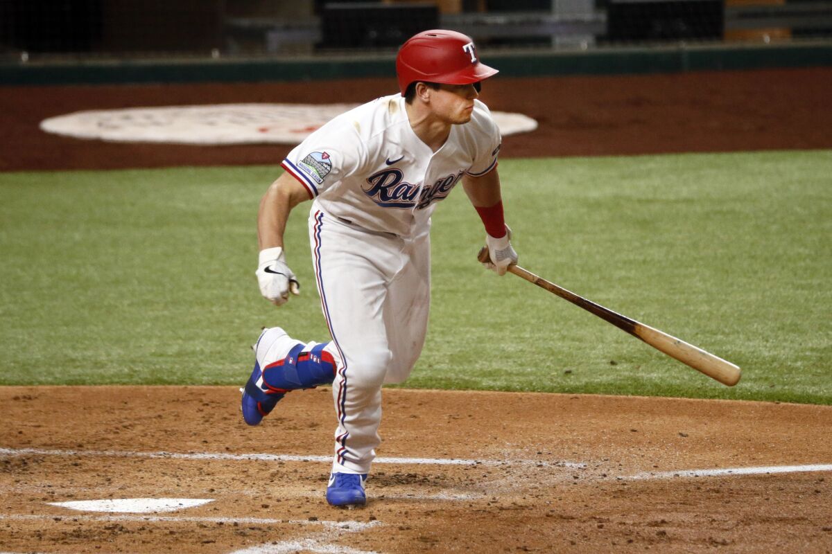 Texas Rangers' Nick Solak follows thru on a two-run single in the first inning of a baseball game against the Seattle Mariners in Arlington, Texas, Tuesday, Aug. 11, 2020. (AP Photo/Ray Carlin)