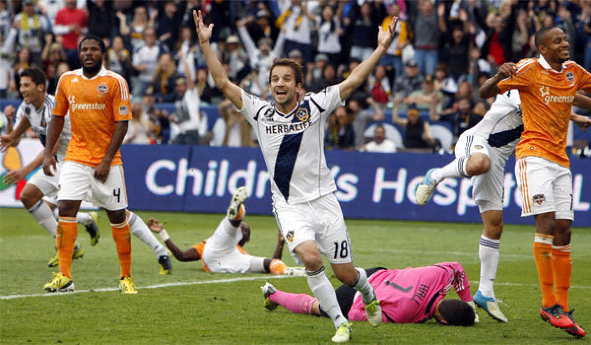 Mike Magee celebrates after a Galaxy teammate's goal during a victory over Houston for the MLS Championship.