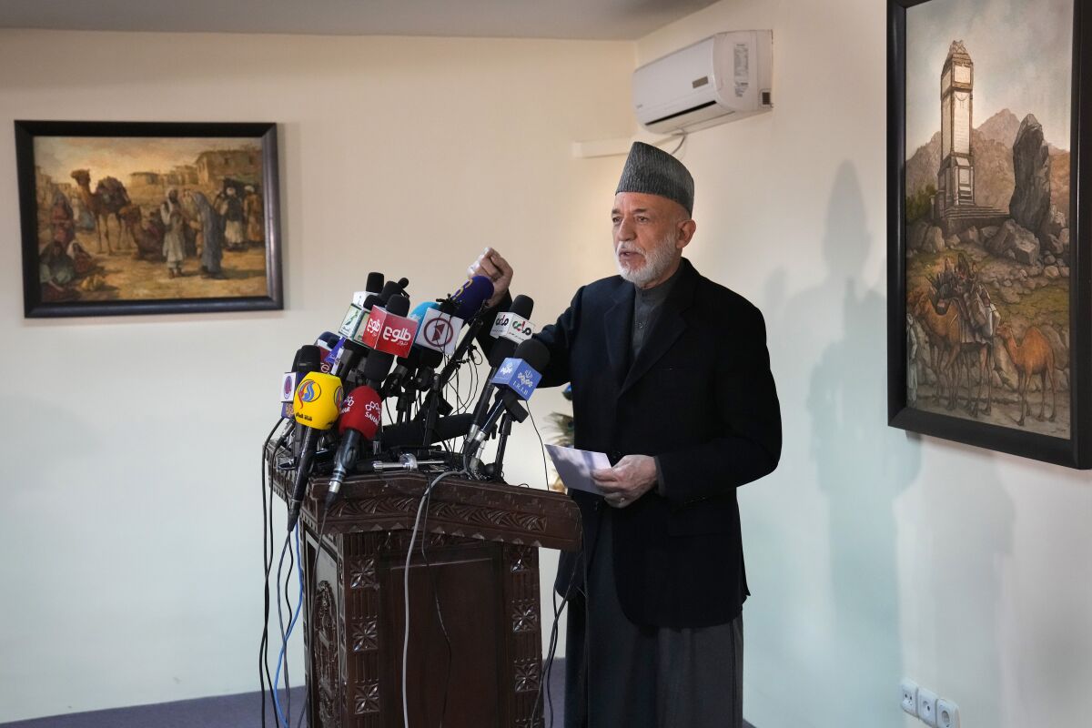Afghanistan's former President Hamid Karzai, speaks during a press conference, in Kabul, Afghanistan, Sunday, Feb. 13, 2022. Karzai called a White House order freeing $3.5 billion in Afghan assets for America's 9/11 families "an atrocity against the Afghan people." He also sought the help of Americans, and in particular the families of the thousands killed on 9/11, to press the White House to rescind last week's order which he said was both "unjust and unfair." (AP Photo/Hussein Malla)