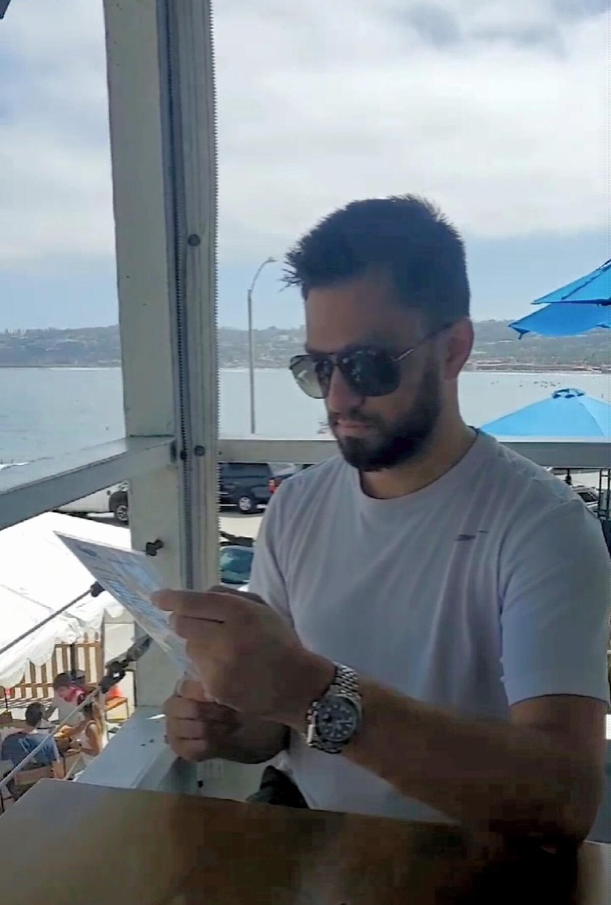 Michael Sinha sits at Brockton Villa in La Jolla during his and Kelsey Halvorsen's first visit to California in August 2020.