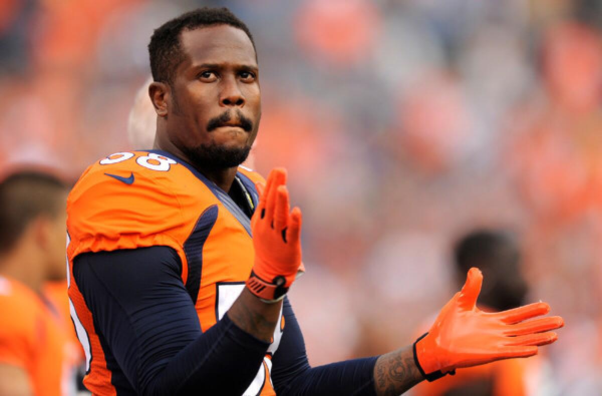 Broncos All-Pro linebacker Von Miller watches an exhibition game against the St. Louis Rams.