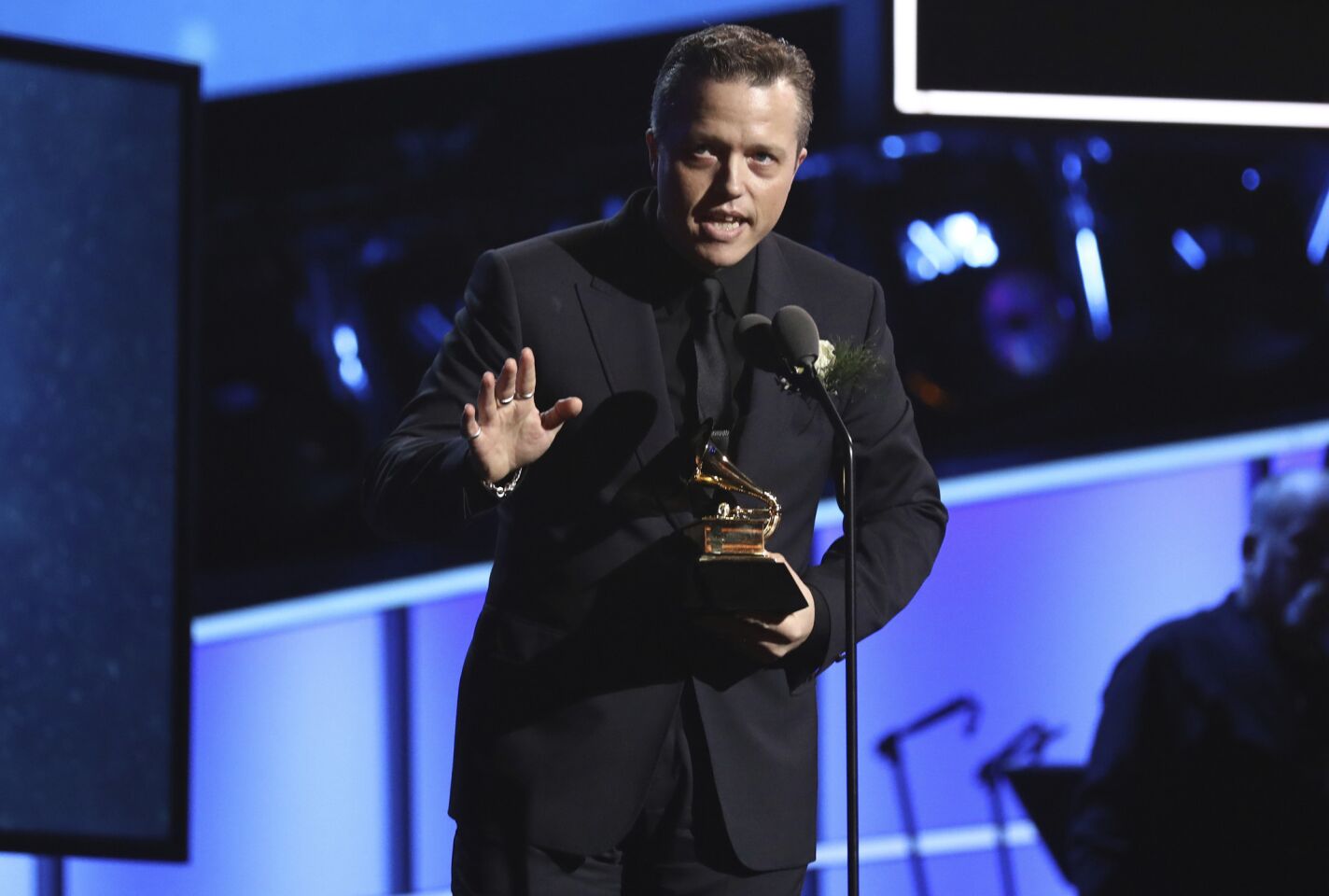 Jason Isbell accepts the American roots song award for "If We Were Vampires" at the pre-telecast show.