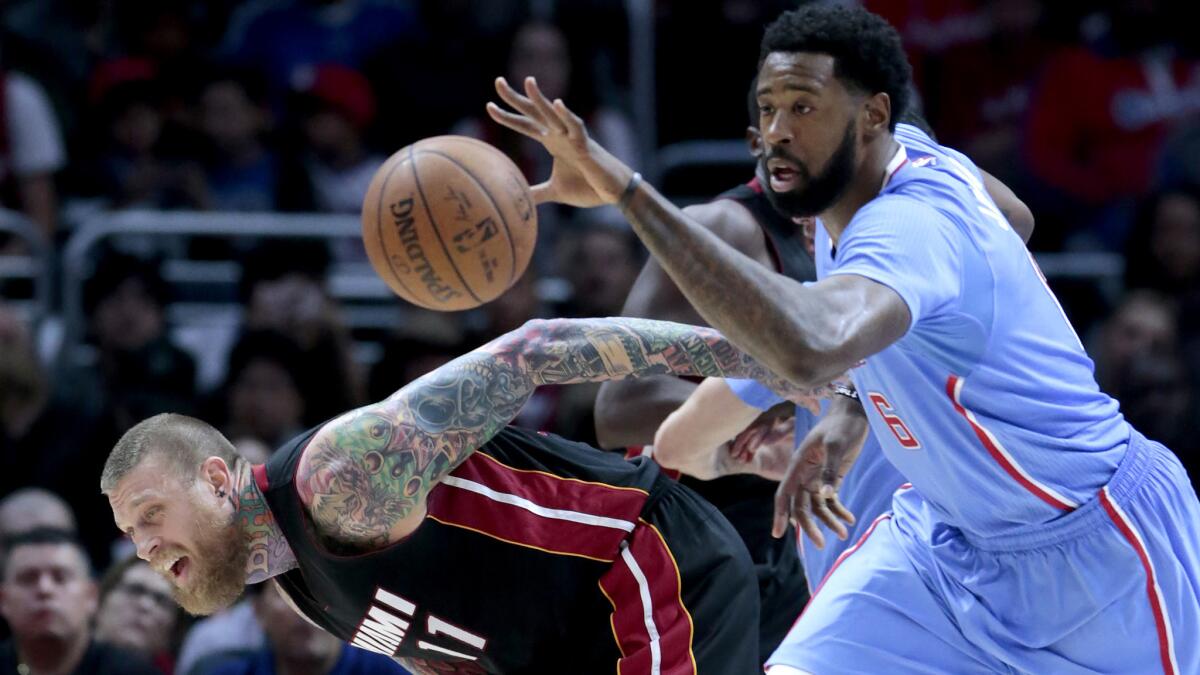 Clippers center DeAndre Jordan steals the ball from Heat forward Chris Andersen during a game Jan. 11, 2015.