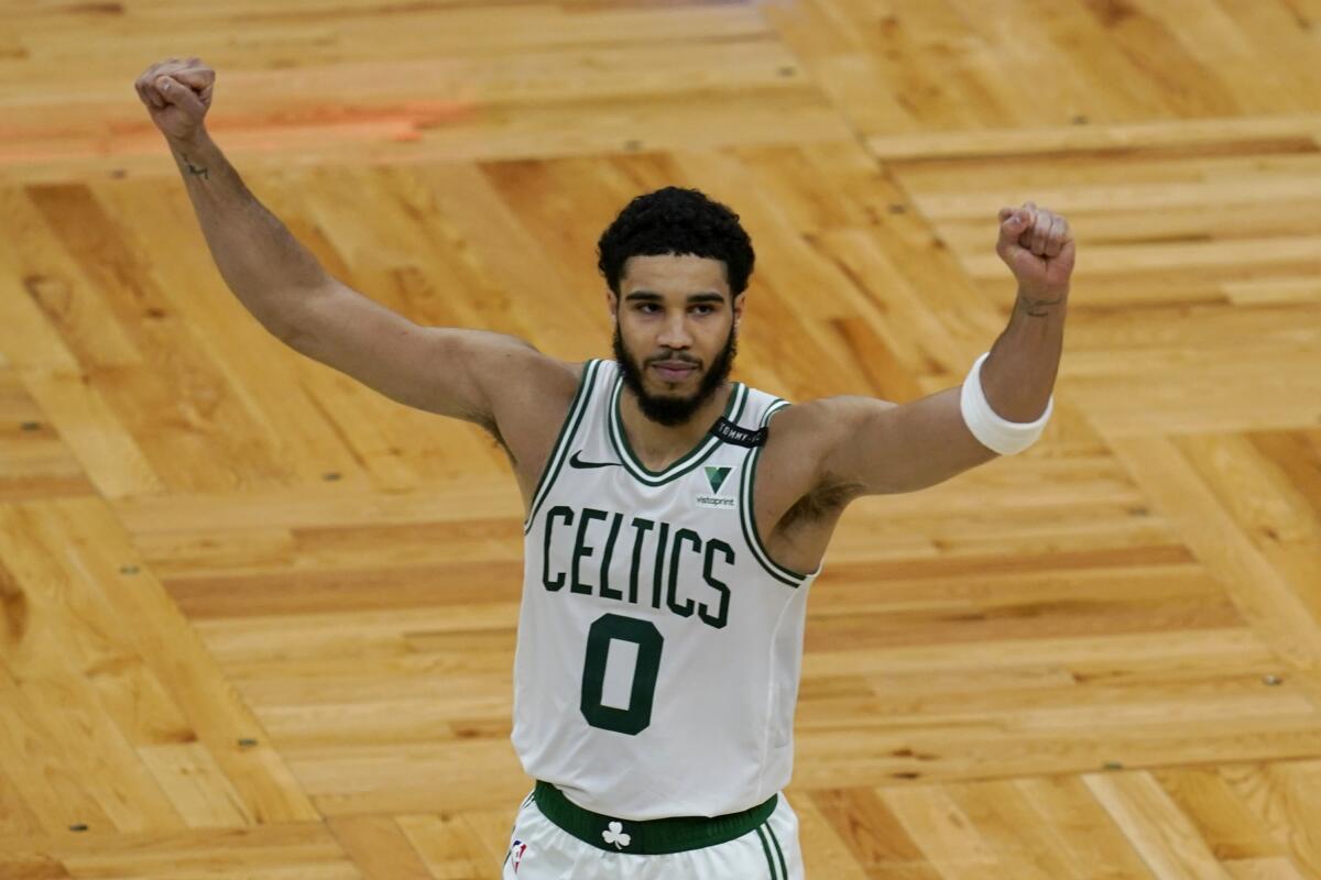 Boston Celtics forward Jayson Tatum (0) celebrates after an NBA basketball game against the San Antonio Spurs.