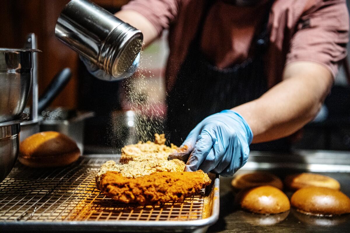 Fried chicken is seasoned to order inside Ronnie's Kickin'.