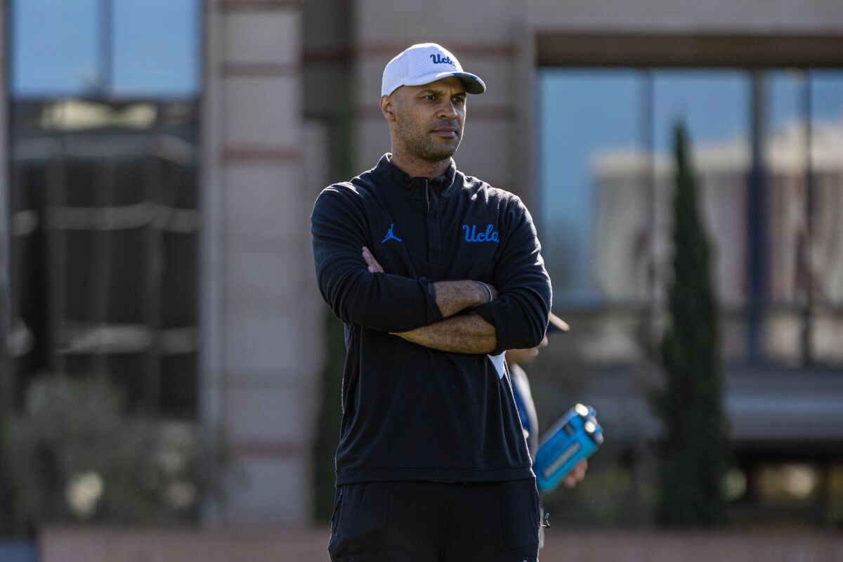 UCLA defense coordinator D'Anton Lynn watches players during a recent training session. April 2023.