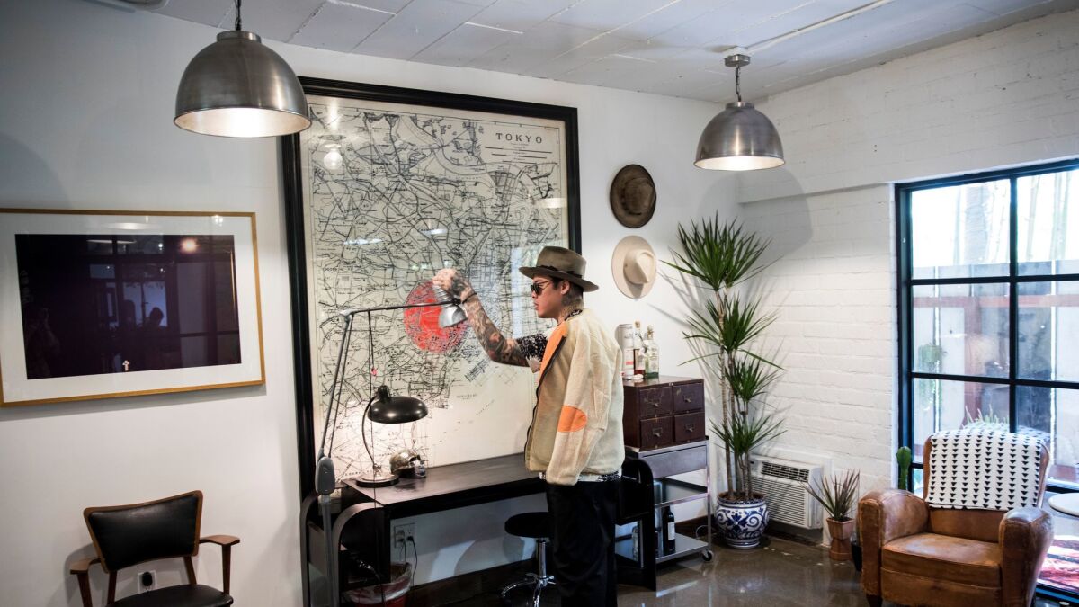 Celebrity tattoo artist Brian Woo's new studio in Hollywood allows him to have clients step into his curated world of art, furniture and design. (Jay L. Clendenin / Los Angeles Times)
