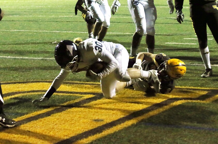 Newport Harbor's Henry Slater (30) dives for his second touchdown against Temecula Valley in the CIF Division 6 final.