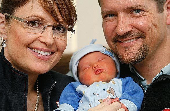 Alaska Gov. Sarah Palin, left, and her husband, Todd, hold their baby boy Trig in Anchorage. Trig, the Palins' fifth child, was born with Down syndrome, a genetic abnormality that impedes physical, intellectual and language development.