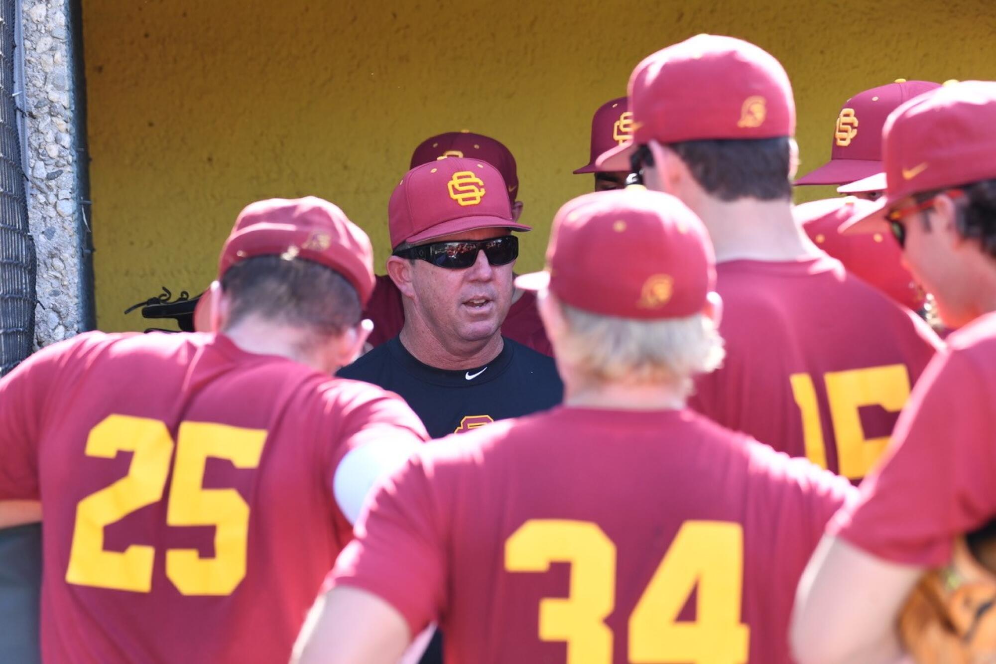 Jason Gill talks to his players during a practice at USC.
