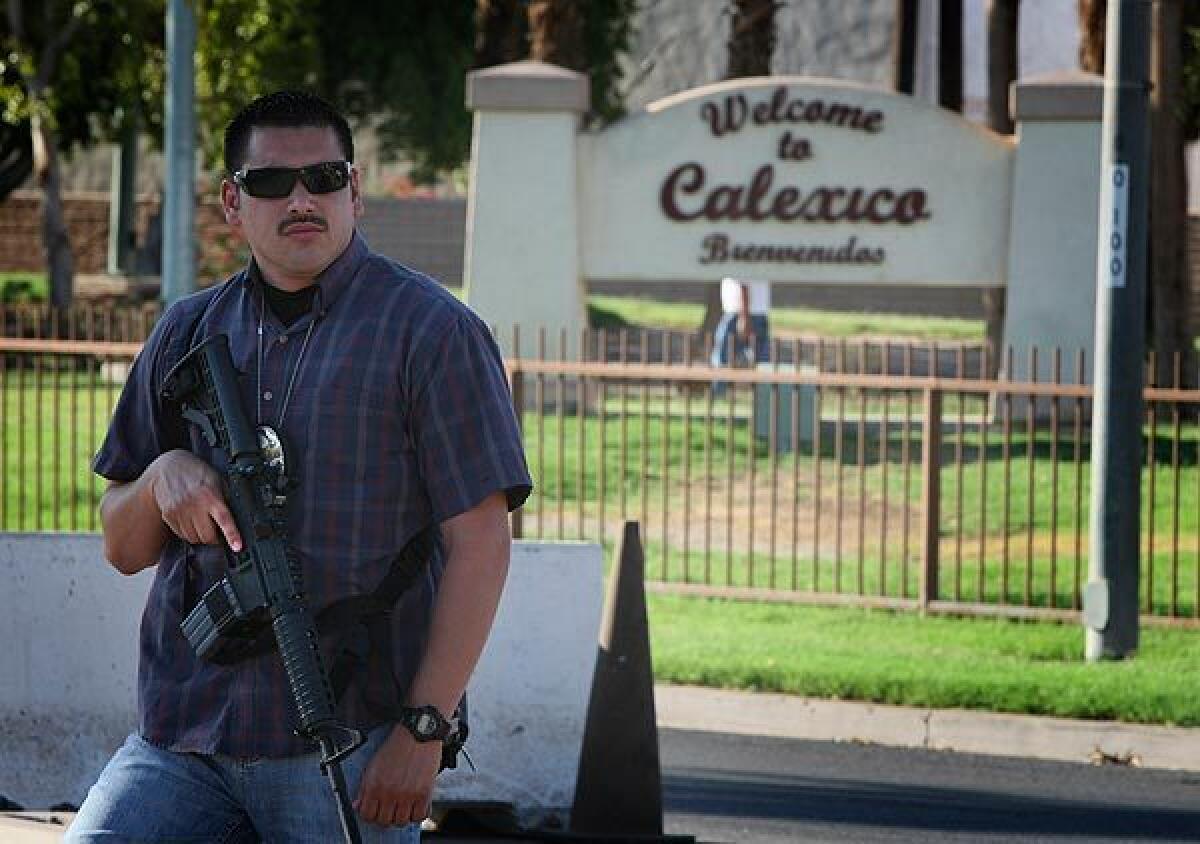 Calexico Police Department Detective Mario Salinas looks toward the border crossing. The entry point is a major corridor through which the Sinaloa drug cartel smuggles drugs into the U.S. Iraq war veteran Roberto Daniel Lopez watched from an area near the park behind Salinas when he worked as a lookout for the cartel. Return to story