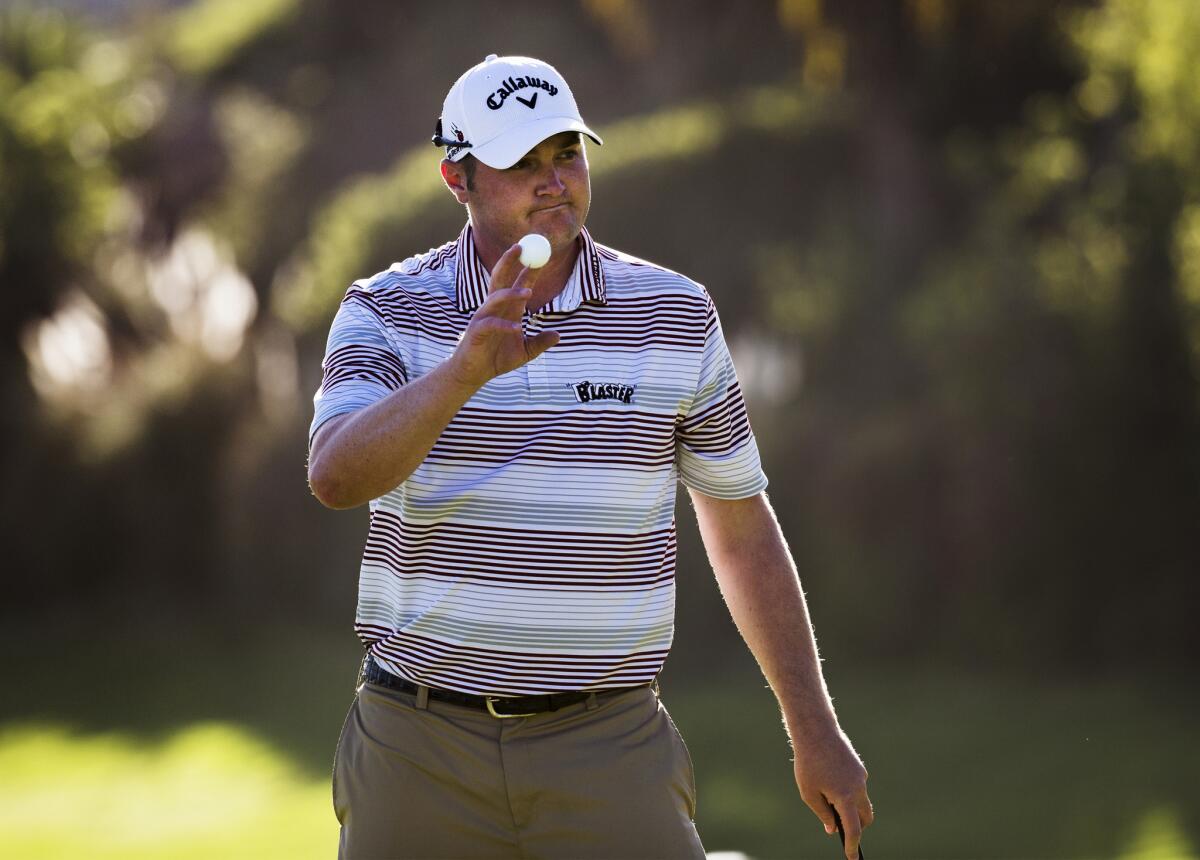 Jason Kokrak acknowledges the crowd Friday after finishing the 18th hole at Riviera Country Club. Kokrak leads the Northern Trust Open at 10 under par after a seven-under 64 on Friday.