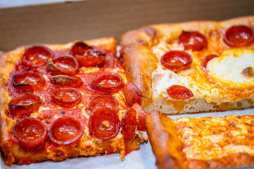 Prince St. Pizza offers multiple pizza style, like Sicilian-style squares with a fluffy crust.
