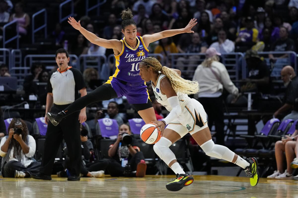 Sparks guard Kia Nurse guards New York Liberty forward Kayla Thornton at Crypto.com Arena on Wednesday.