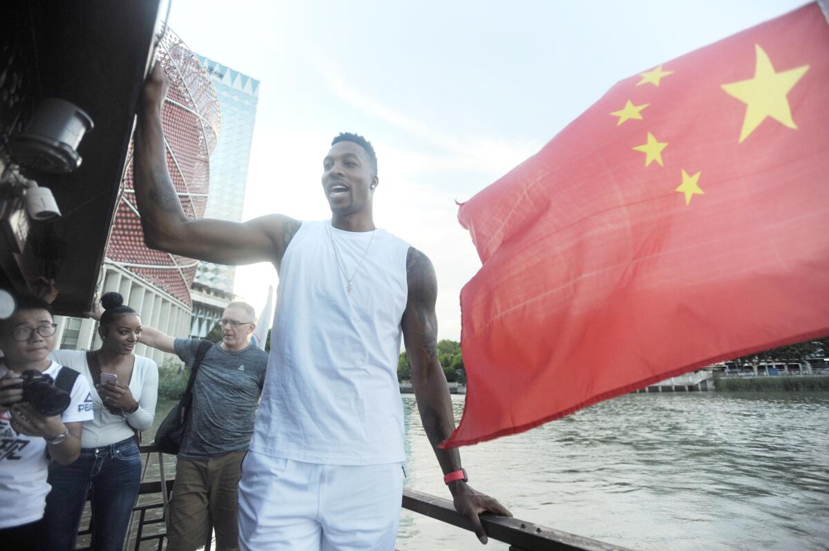 Dwight Howard stands on a boat at East Lake Scenic Area while visiting Wuhan, in the Hubei Province of China in September 2018.