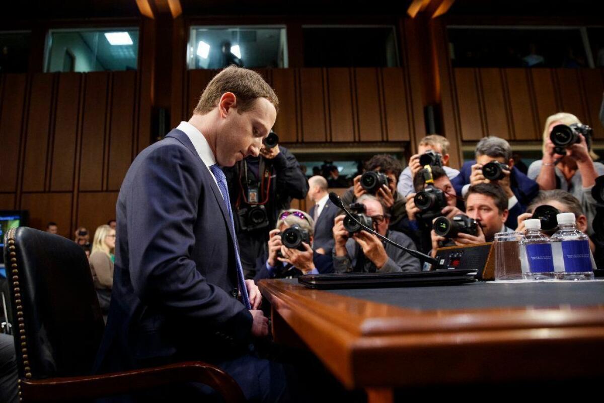 Facebook Chief Executive Mark Zuckerberg arrives to testify before a joint hearing of the Commerce and Judiciary Committees on Capitol Hill in Washington on April 10, 2018.
