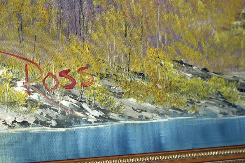 "A Walk in the Woods," the first painting Bob Ross produced for hic iconic show “The Joy of Painting,” sits on display at the home of Modern Artifact owner Ryan Nelson, Tuesday, Sept. 19, 2023, in Wayzata, Minn. Ross was known for his unpretentious approach to painting on his long-running show, “The Joy of Painting,” but now the painting he completed on his first show in 1983 is for sale for nearly $10 million. Minneapolis gallery owner Ryan Nelson calls it the "rookie card" for Ross. (AP Photo/Mark Vancleave)