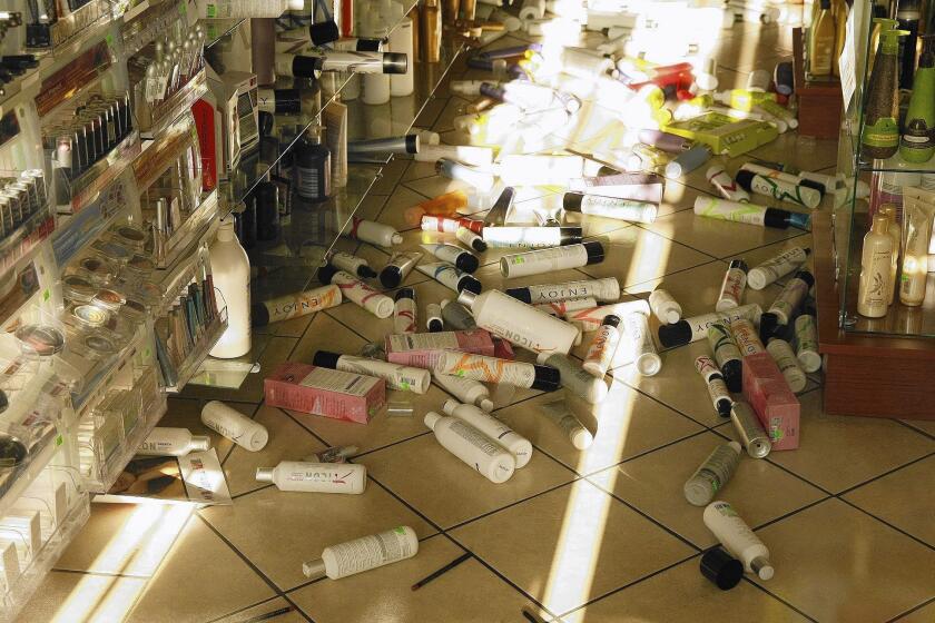 Products lie on the floor of the Sherman Oaks Beauty Center after a magnitude 4.4 earthquake centered in Encino on Monday. Scientists and private companies are working on a statewide early warning system to alert emergency responders and the public to oncoming quakes.