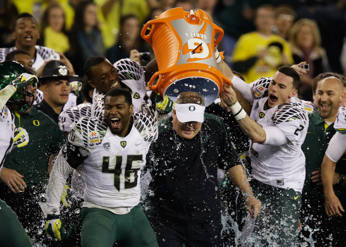 Oregon players dump Gatorade on coach Chip Kelly after the Ducks beat Kansas State 35-17 in the Fiesta Bowl.