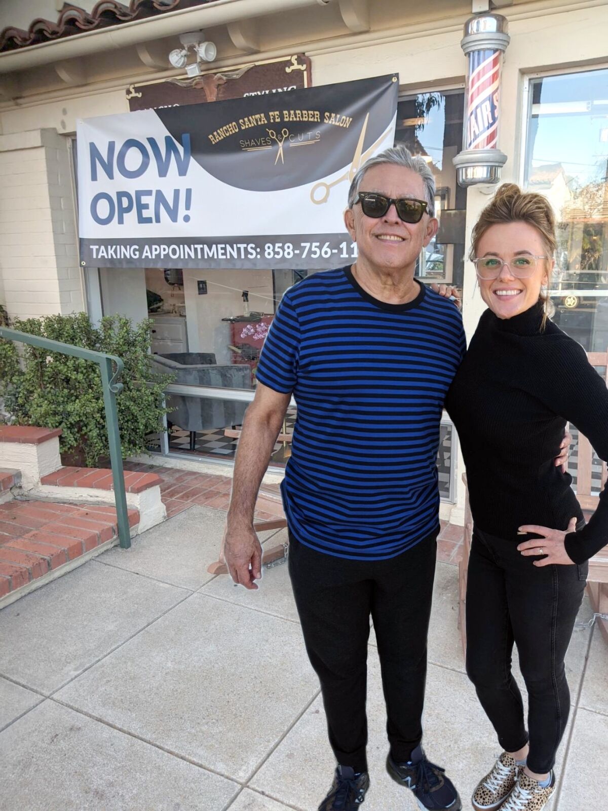 New Rancho Santa Fe Barber Salon owner Juleah Roll with former owner Dan Lara.