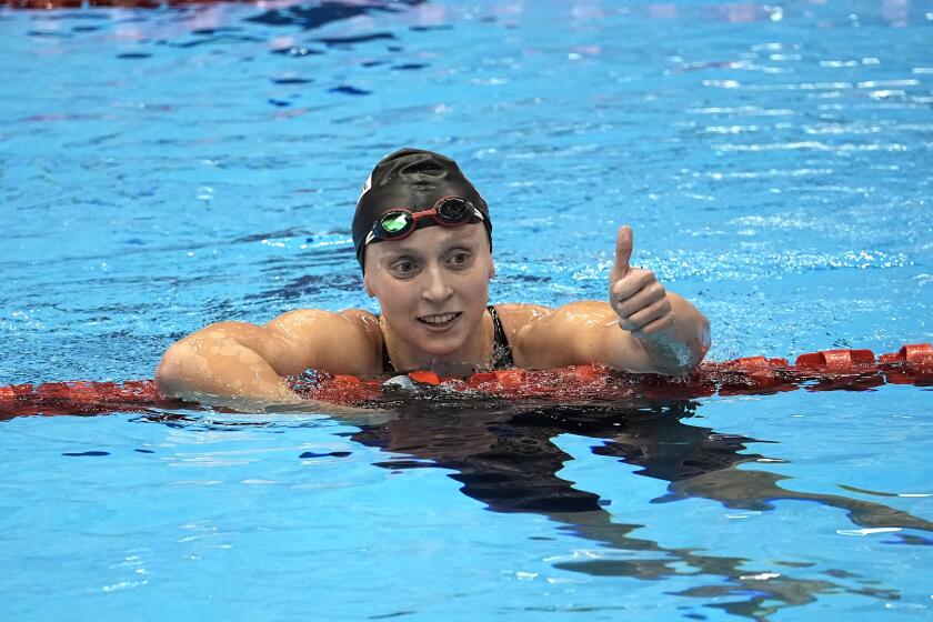 Katie Ledecky, of the United States, celebrates after winning the women's 800-meter freestroke final at the World Swimming Championships in Fukuoka, Japan, Saturday, July 29, 2023. (AP Photo/David J. Phillip)