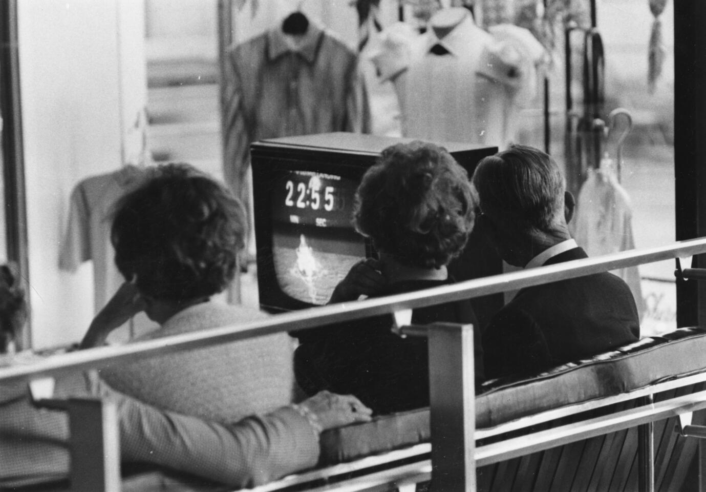 Visitors to Chicago watch the Apollo 11 moon landing on a TV brought into the lobby of the Sheraton Chicago on July 20, 1969.