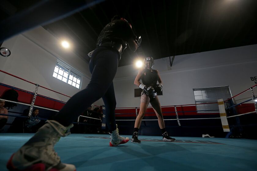 BELL GARDENS, CALIF. - FEB. 28, 2023. Seniesa Estrada spars at a nondescript gym in Bell Gardens. Estrada is an undefeated boxing champion from East L.A. She started out in the sport at age 13. Now 30, she's built up a pro career and is scheduled to challenge WBC world champion Tina Rupprecht in March. (Luis Sinco / Los Angeles Times)