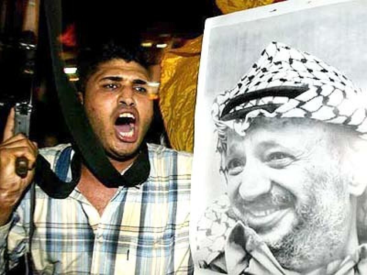 A militant with Yasser Arafats Fatah faction shouts slogans during a rally in Gaza City. Palestinian leaders are said to be worried about instability in Gaza upon his death.