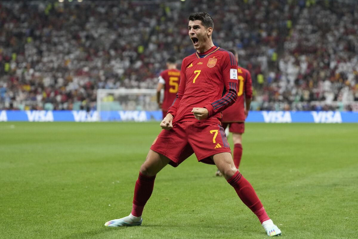 Spain's Alvaro Morata celebrates after scoring the opening goal during the World Cup group E soccer match between Spain and Germany, at the Al Bayt Stadium in Al Khor , Qatar, Sunday, Nov. 27, 2022. (AP Photo/Matthias Schrader)