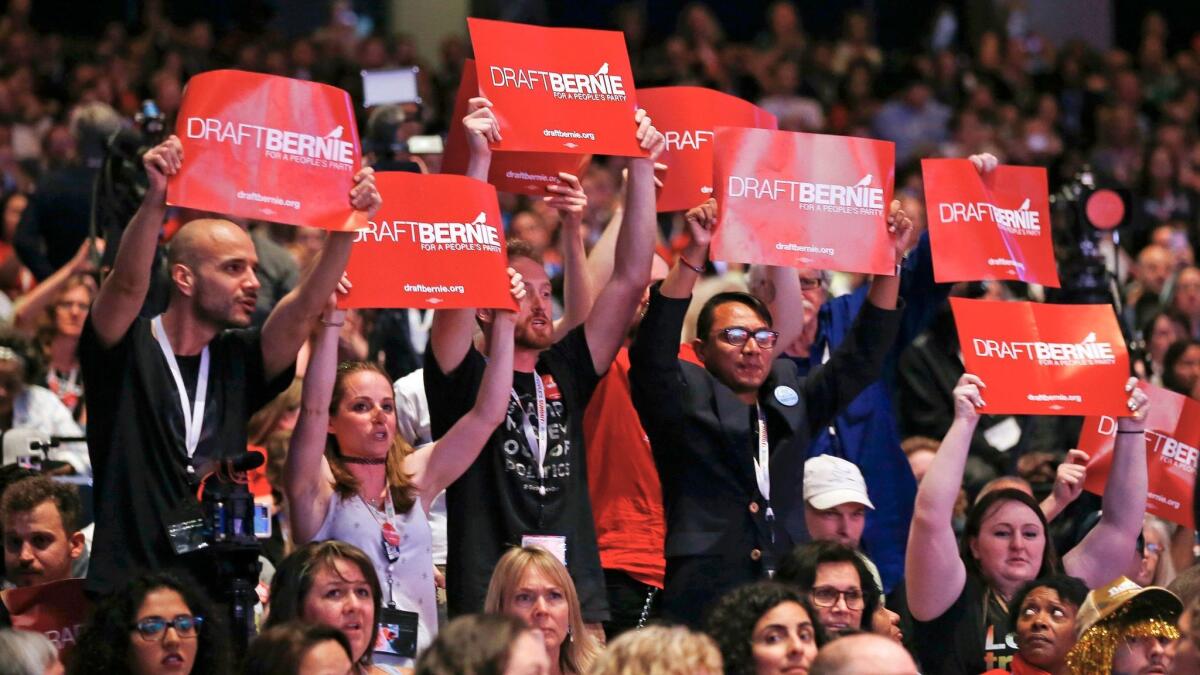 Supporters of Bernie Sanders cheer during his speech at the People's Summit in Chicago in June.