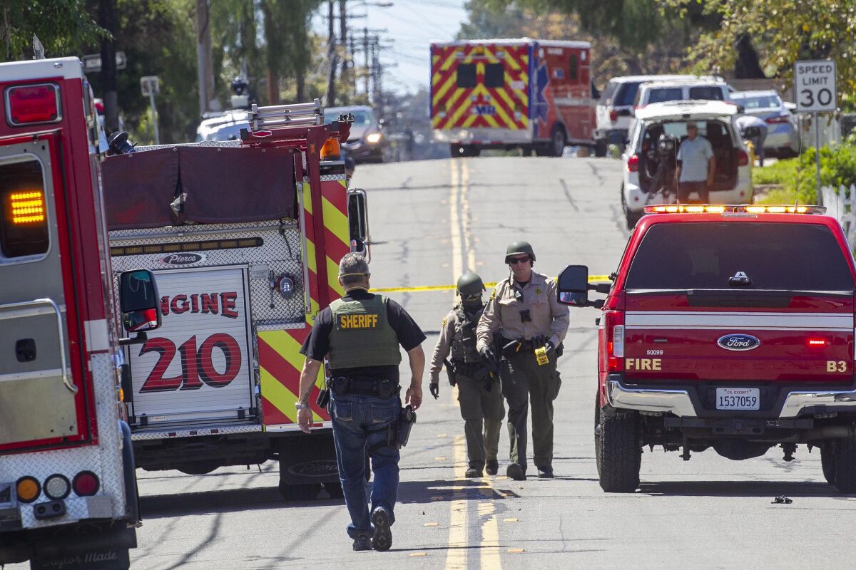 Sheriff's deputies closed off a street after two teenage girls were fatally shot in Lemon Grove on April 14, 2020.